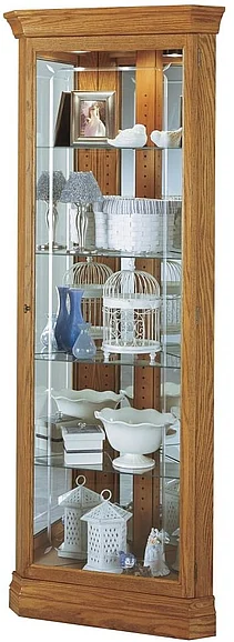 Howard Miller Hammond Corner Curio Cabinet in Golden Oak 680347